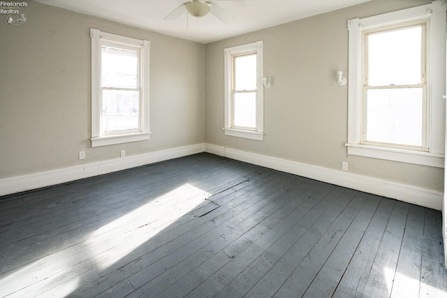 unfurnished room featuring plenty of natural light, ceiling fan, and light hardwood / wood-style flooring