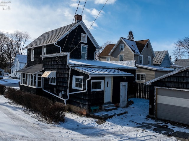 view of front of property with an outbuilding and a garage