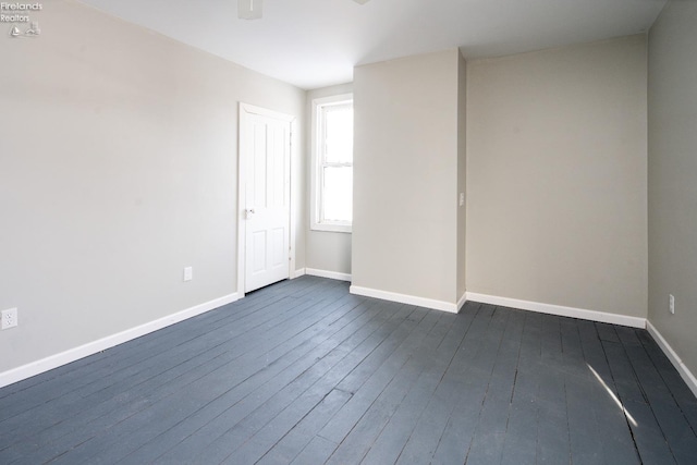 spare room featuring dark hardwood / wood-style flooring