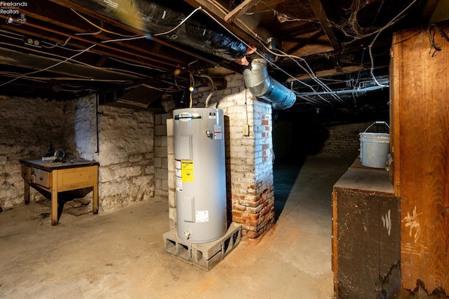 basement featuring electric water heater