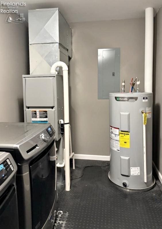 interior space with stacked washer / drying machine, electric panel, and water heater