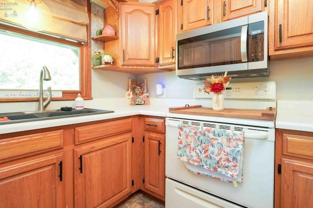 kitchen with white electric range and sink