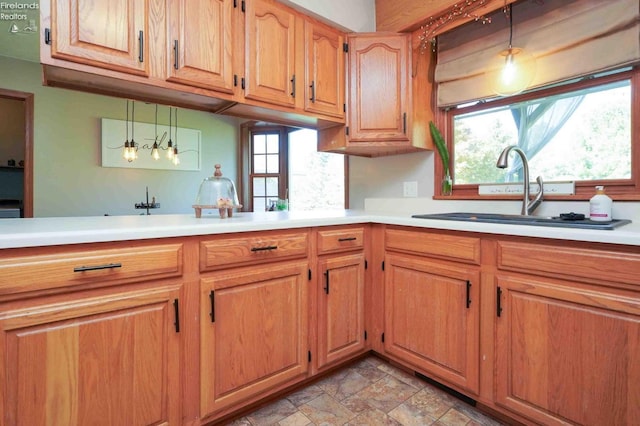 kitchen featuring sink and decorative light fixtures