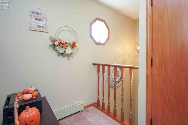 interior space featuring a baseboard radiator and carpet floors