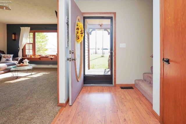 entryway with light hardwood / wood-style flooring