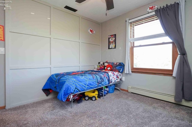 bedroom featuring ceiling fan, carpet flooring, and baseboard heating