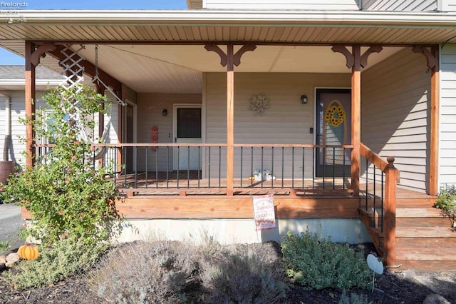 entrance to property with covered porch