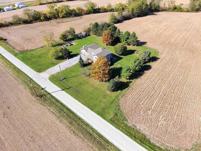 birds eye view of property with a rural view