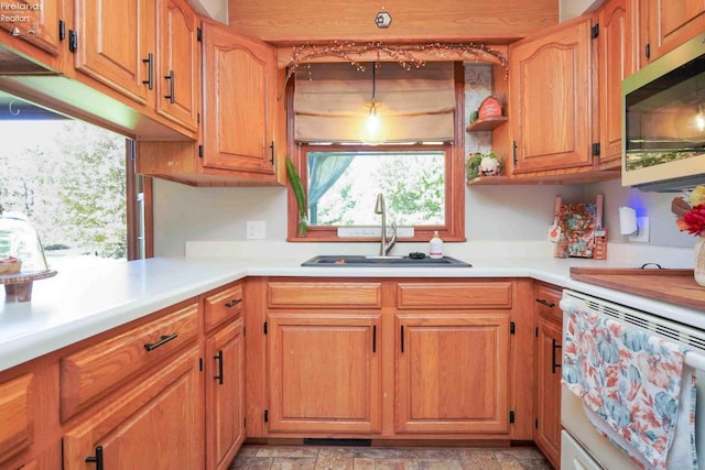 kitchen featuring sink and dishwashing machine