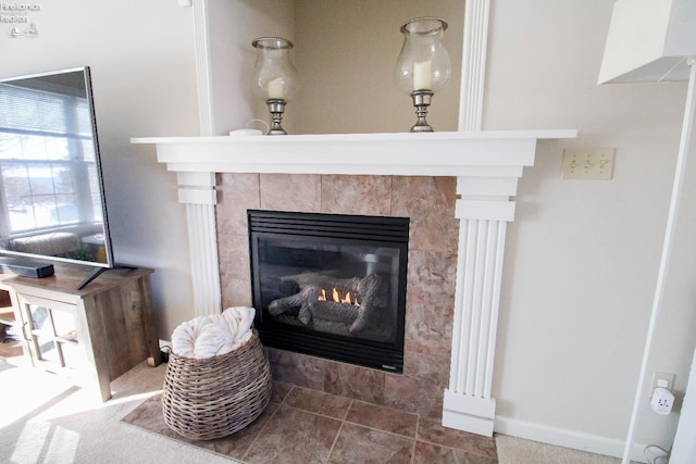 room details featuring a tile fireplace