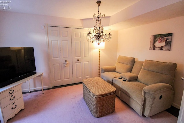 living room featuring light carpet and a chandelier