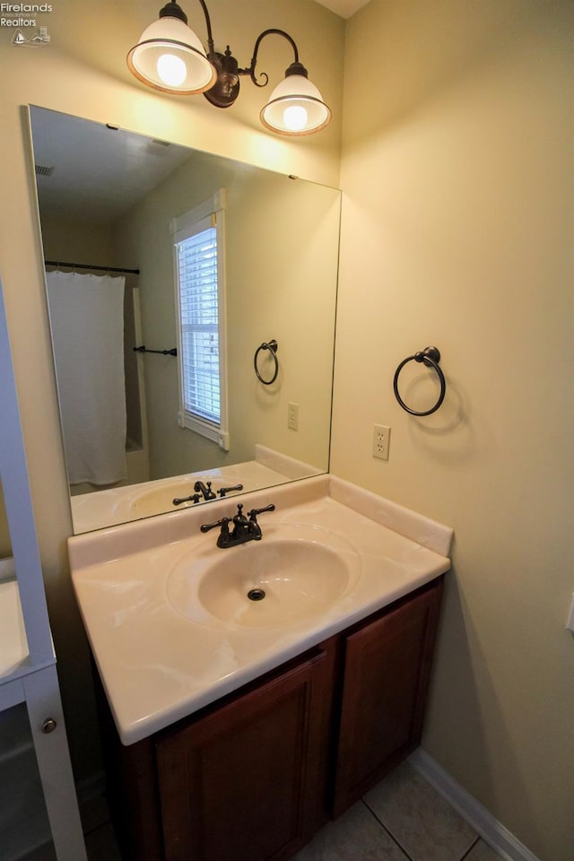 bathroom with vanity and tile patterned flooring