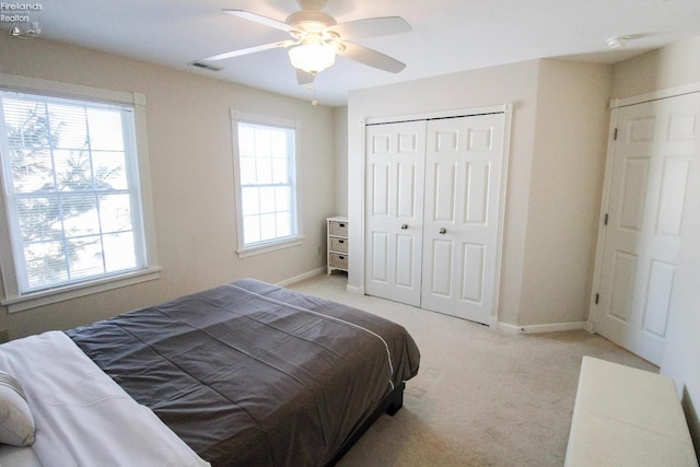 carpeted bedroom featuring ceiling fan