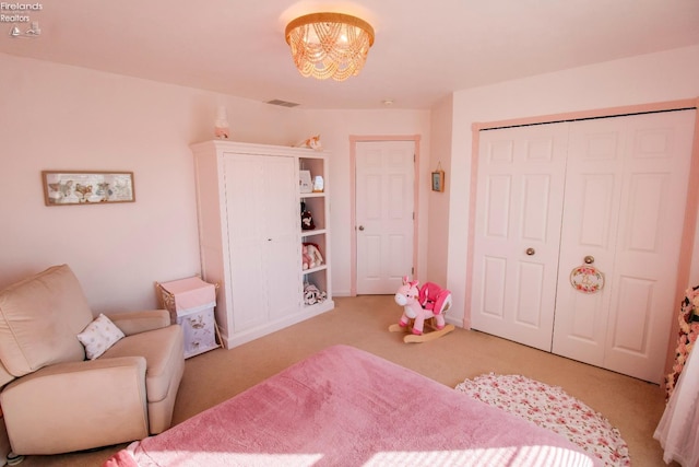 bedroom featuring light carpet