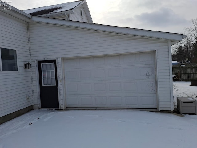 view of snow covered garage