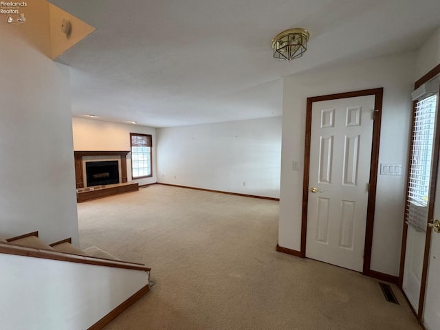 unfurnished living room with carpet floors