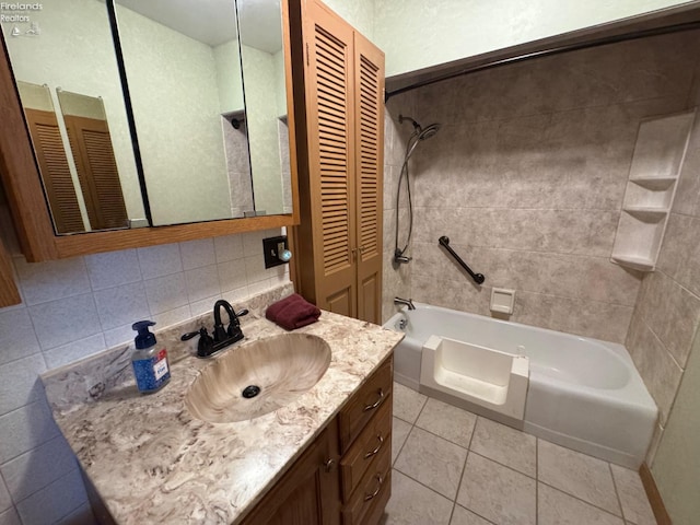 bathroom featuring decorative backsplash, tile patterned floors, vanity, and  shower combination