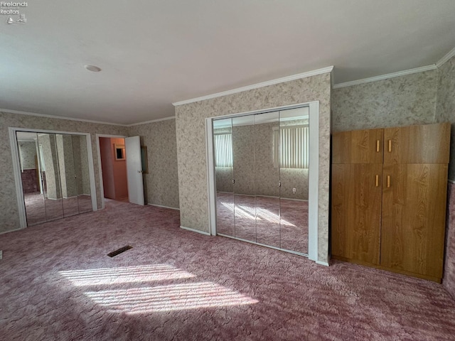 unfurnished bedroom with carpet and crown molding