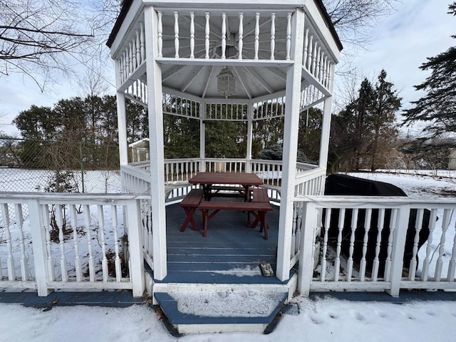 snow covered deck featuring a gazebo