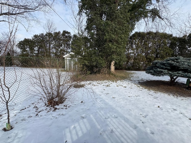 view of yard covered in snow