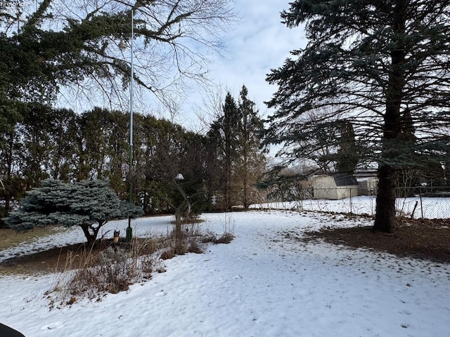 view of yard layered in snow