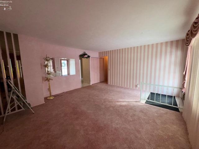 unfurnished room with carpet flooring