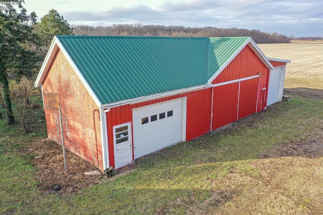 garage featuring a yard