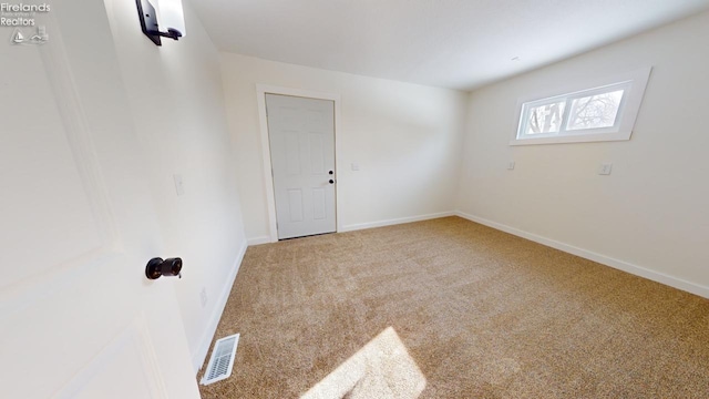 empty room with carpet flooring