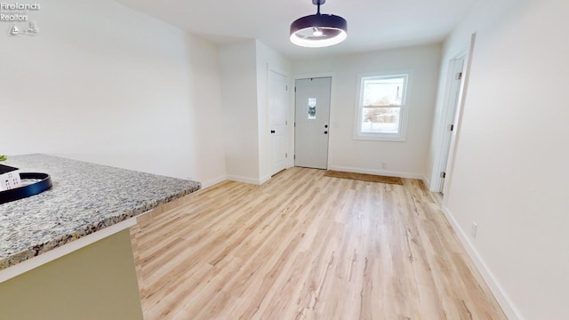 foyer with light hardwood / wood-style flooring