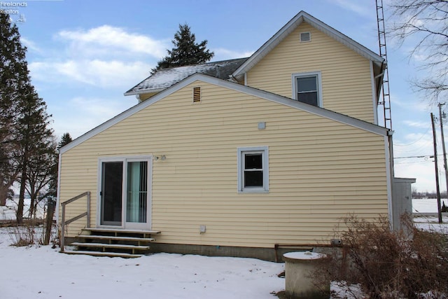 view of snow covered house