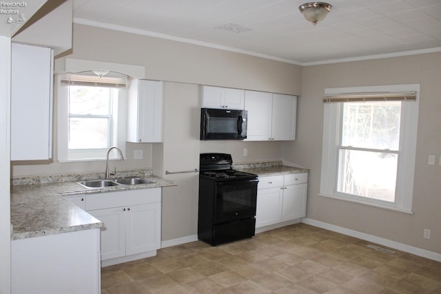 kitchen featuring sink, black appliances, and white cabinets