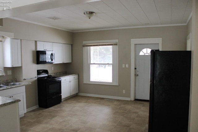 kitchen with white cabinetry, sink, ornamental molding, and black appliances