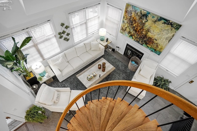 tiled living room featuring a wealth of natural light