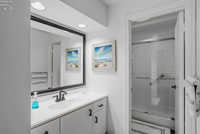 bathroom featuring vanity and walk in shower