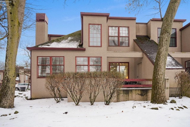 view of snow covered house