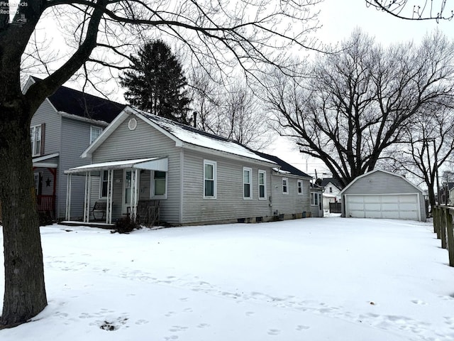 view of front of property with a garage and an outdoor structure