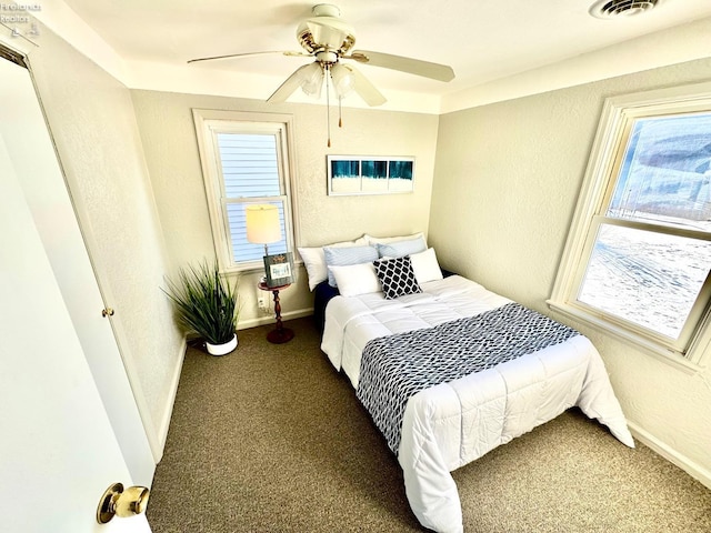 carpeted bedroom with ceiling fan