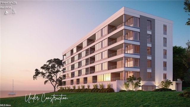 outdoor building at dusk with a water view