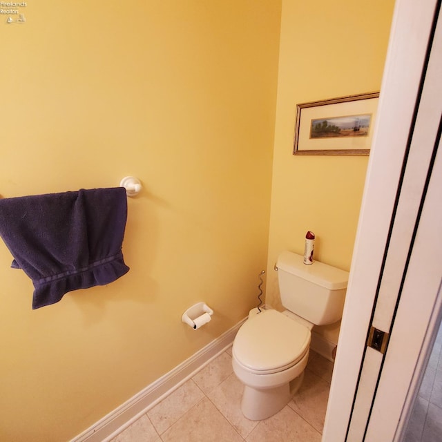 bathroom featuring tile patterned flooring and toilet