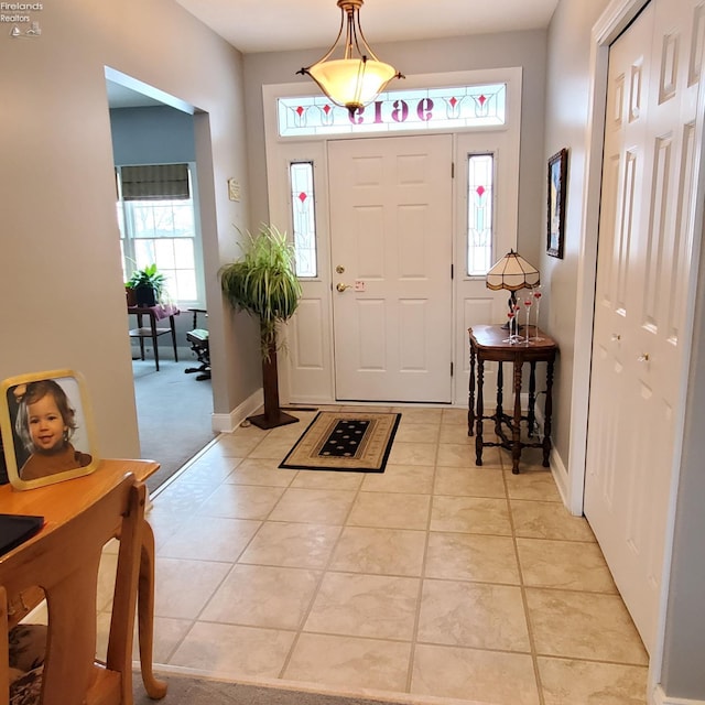 foyer with light tile patterned floors