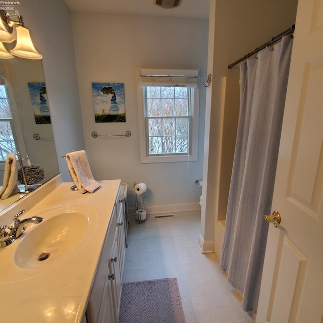 bathroom with vanity and a shower with shower curtain