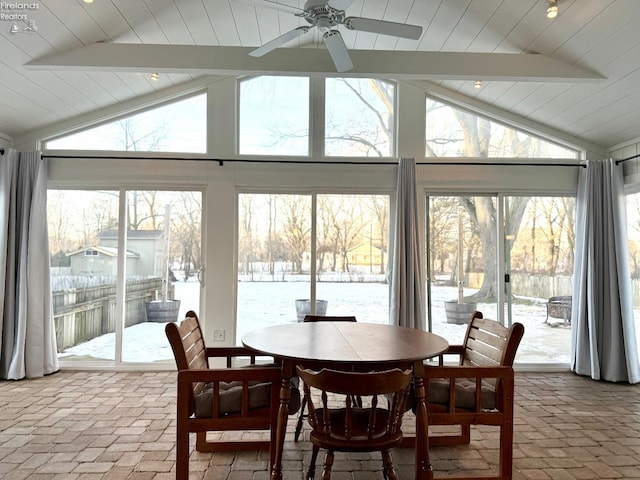 sunroom / solarium with lofted ceiling and ceiling fan