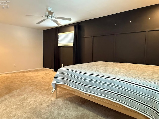 bedroom with ceiling fan and carpet flooring