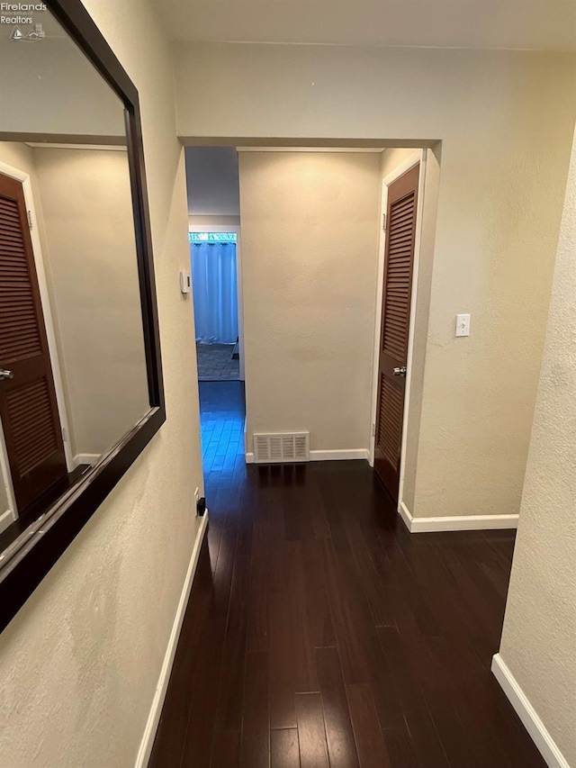 hall featuring dark hardwood / wood-style flooring