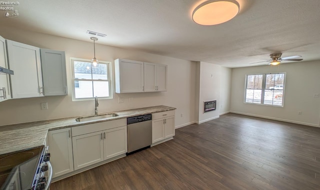 kitchen featuring white cabinetry, sink, plenty of natural light, and stainless steel appliances