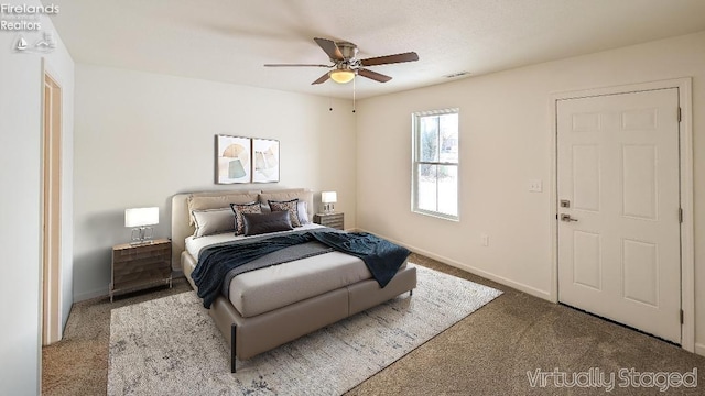 carpeted bedroom with ceiling fan