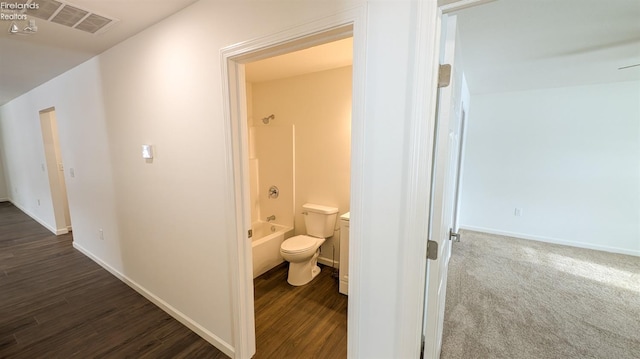 corridor with dark hardwood / wood-style floors