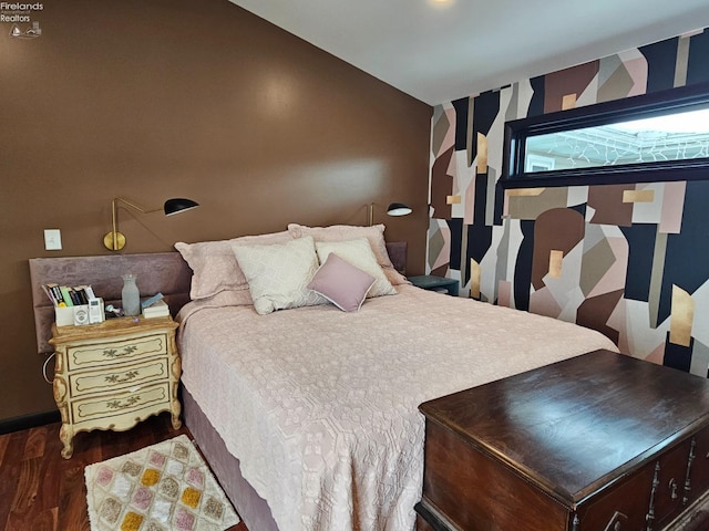 bedroom with dark hardwood / wood-style flooring