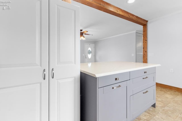 kitchen featuring crown molding, gray cabinets, and ceiling fan