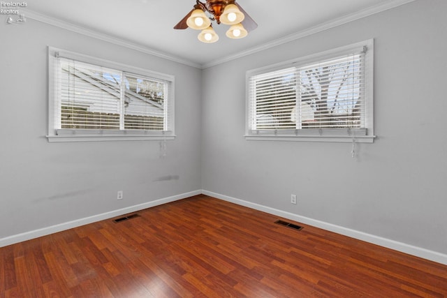 unfurnished room featuring hardwood / wood-style flooring, ornamental molding, and ceiling fan